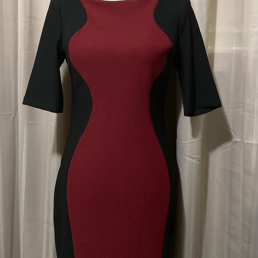 Bisou Bisou form fitting dress. Burgundy and black.